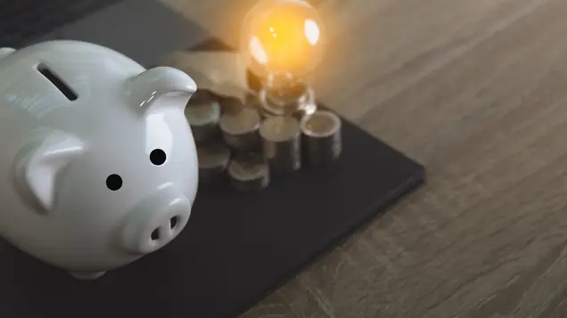 Spargris och glödlampa